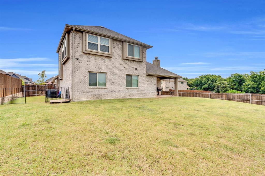 5038 Ridgehurst Lane Midlothian, TX 76065 - Photo 28 of 37 a front view of a house with a yard
