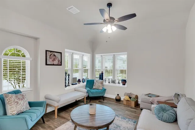 a living room with furniture and a large window