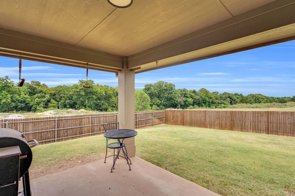 5038 Ridgehurst Lane Midlothian, TX 76065 - Photo 32 of 37 a view of a chair and table on the terrace