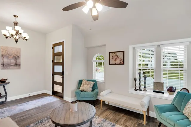 a living room with furniture and a large window