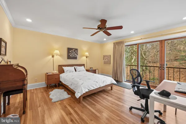 a bedroom with furniture and a window