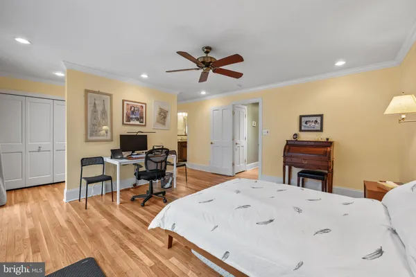 a view of a workspace with furniture and wooden floor