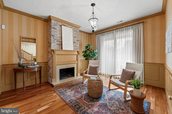 a living room with furniture a window and a fireplace