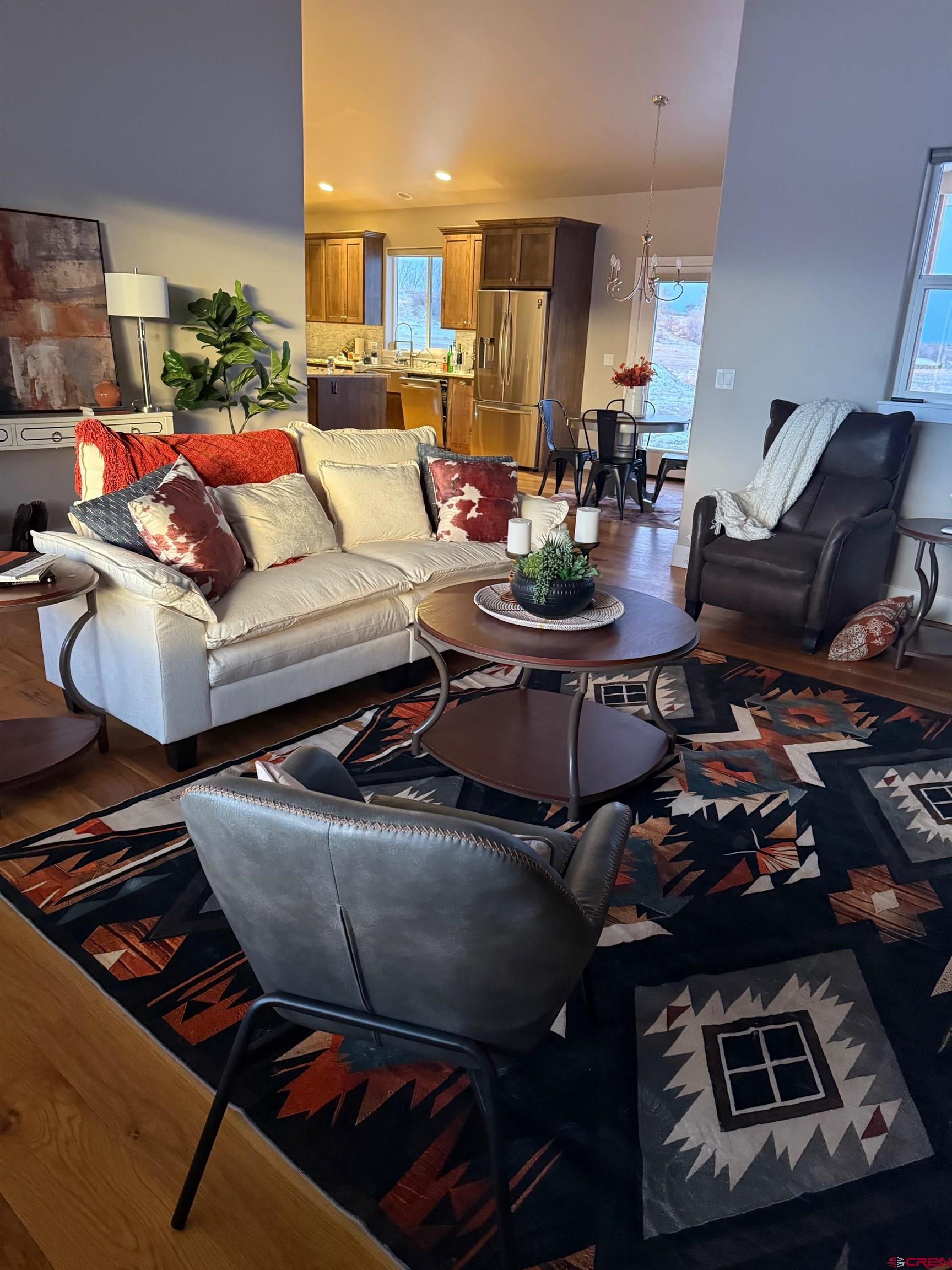 17823 6353 Road Montrose, CO 81403 - Photo 6 of 39 a living room with furniture and a rug