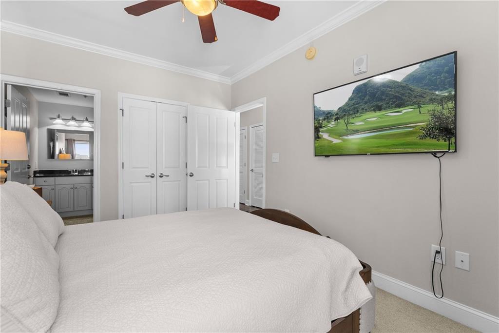 755 West Broad Street, Unit 820 Athens, GA 30601 - Photo 28 of 64 a bedroom with a bed and a painting on the wall