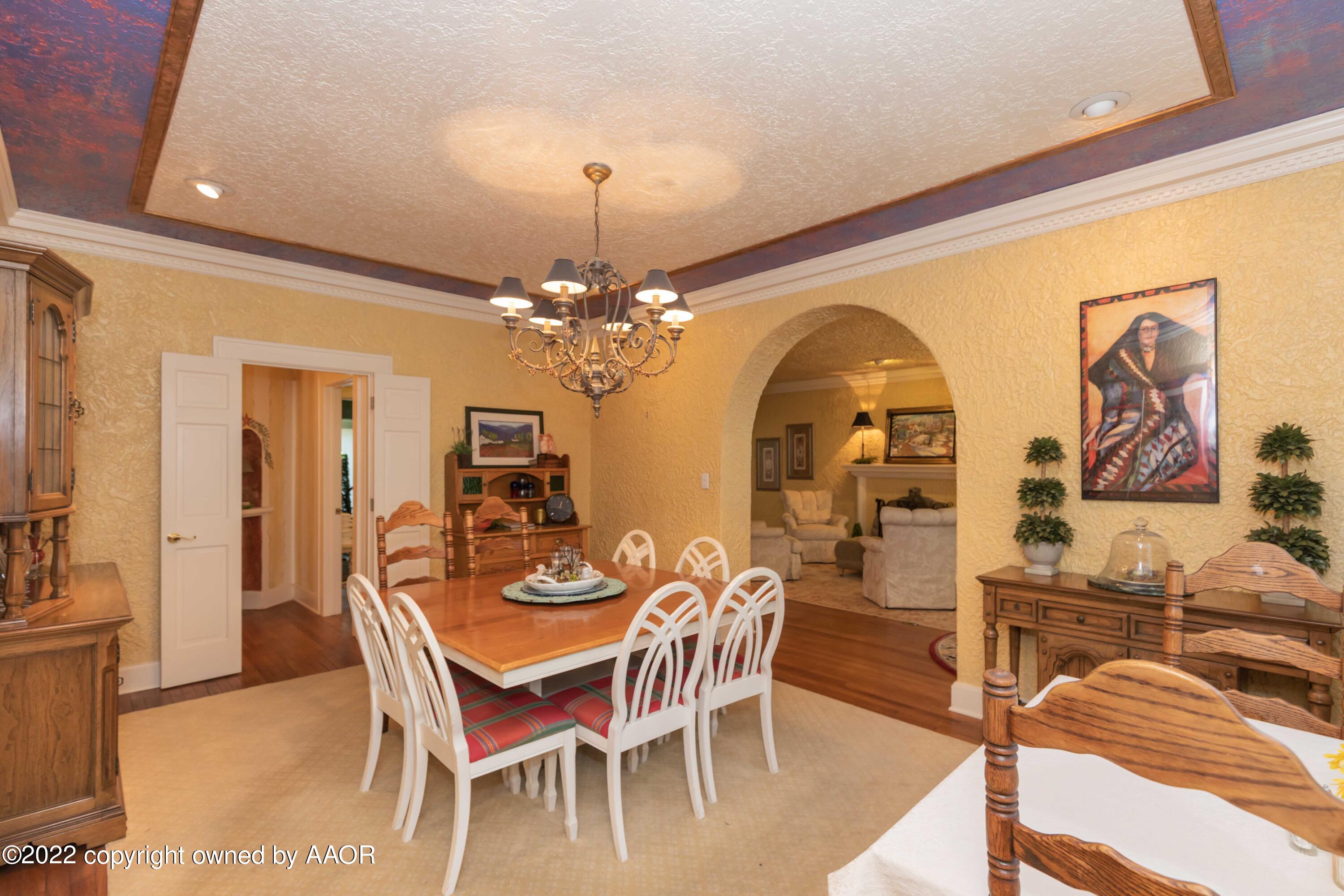 1607 South Harrison Street Amarillo, TX 79102 - Photo 12 of 71 a view of a dining room with furniture and chandelier