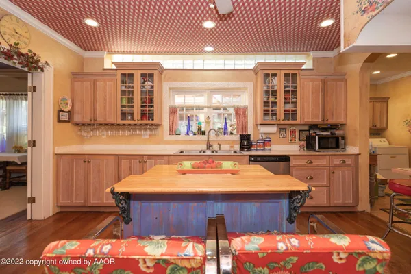 a large kitchen with a table and chairs
