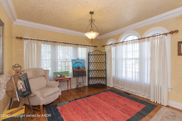 a bedroom with a bed and a mirror