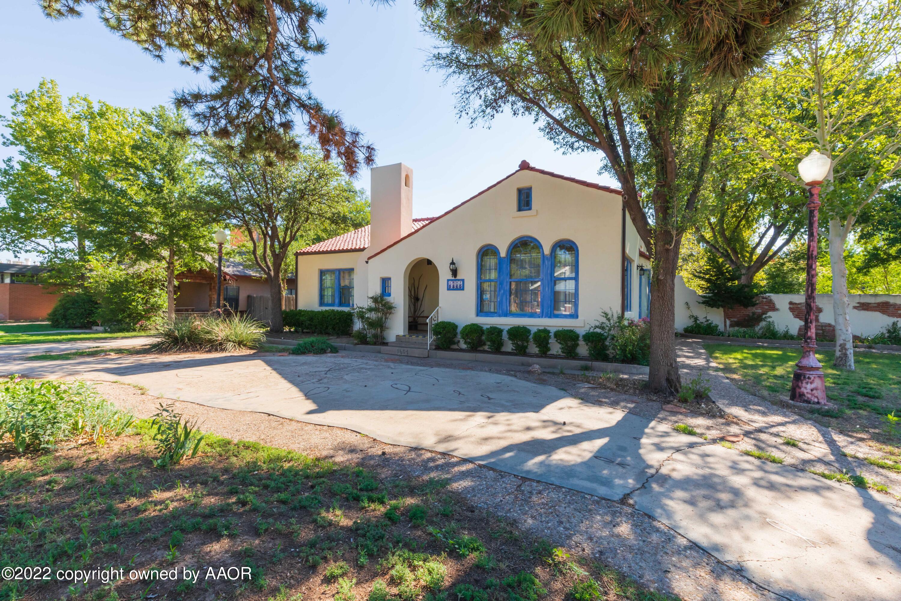 1607 South Harrison Street Amarillo, TX 79102 - Photo 3 of 71 a view of a white house with a yard and large tree