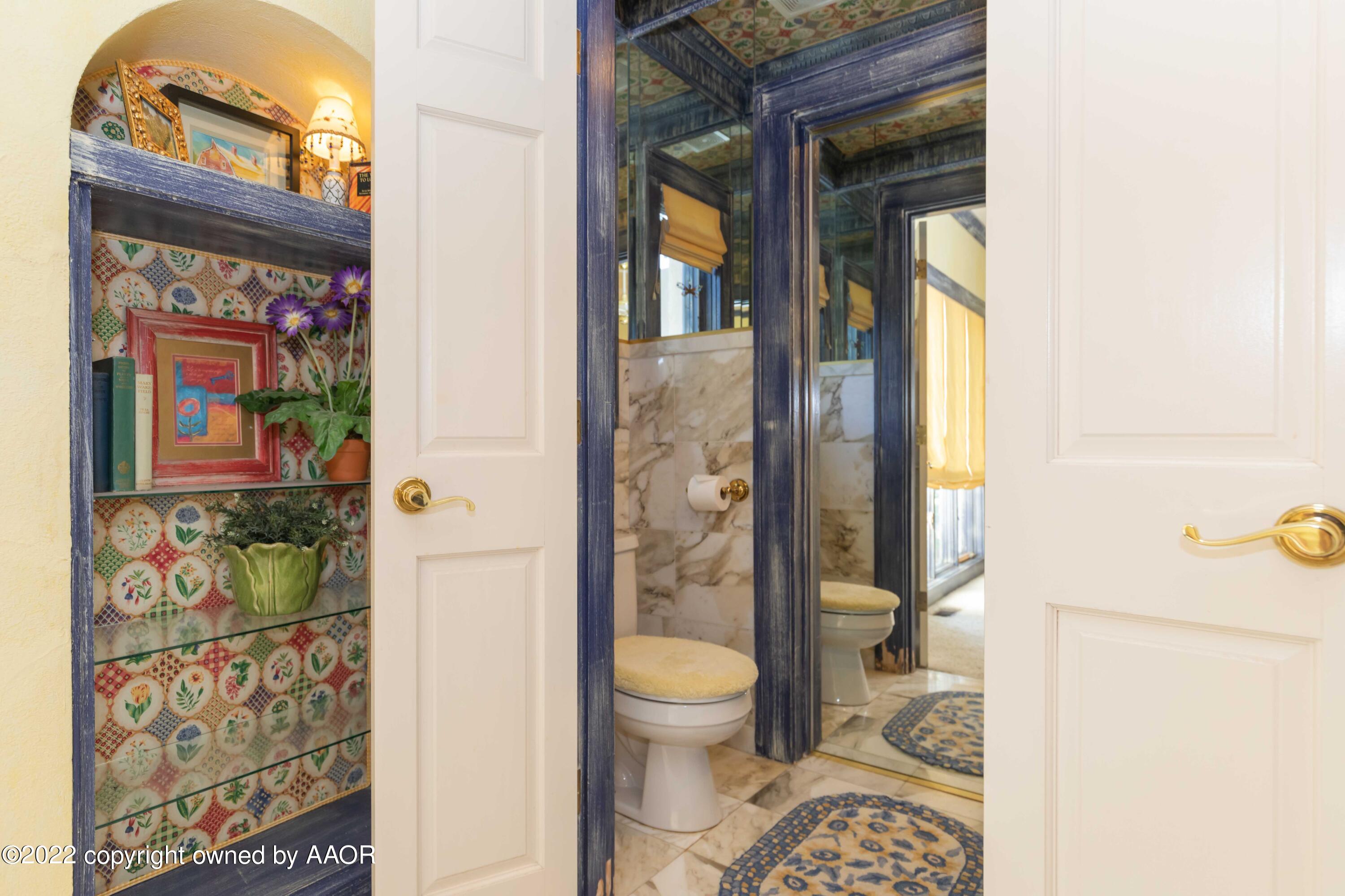 1607 South Harrison Street Amarillo, TX 79102 - Photo 36 of 71 a bathroom with a toilet a sink and a shower curtain