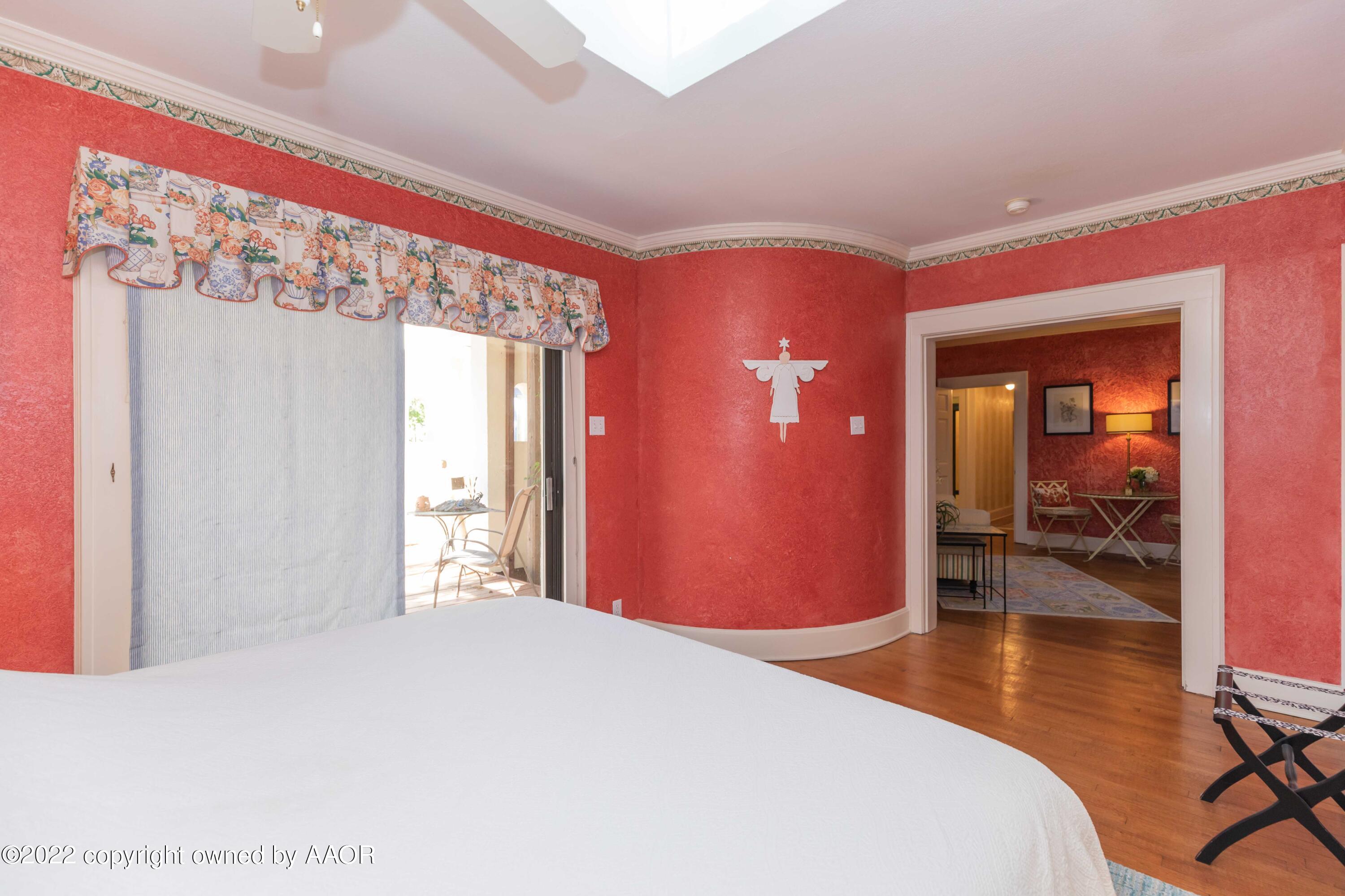 1607 South Harrison Street Amarillo, TX 79102 - Photo 52 of 71 a bedroom with a bed and wooden floor