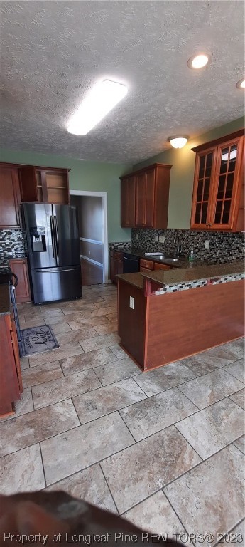 3513 Talus Road Fayetteville, NC 28306 - Photo 14 of 37 a large kitchen with granite countertop a stove a sink and a refrigerator