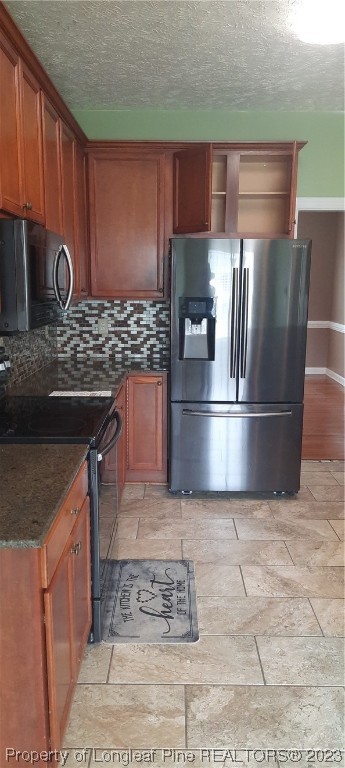 3513 Talus Road Fayetteville, NC 28306 - Photo 17 of 37 a kitchen with stainless steel appliances granite countertop a stove a refrigerator and a sink