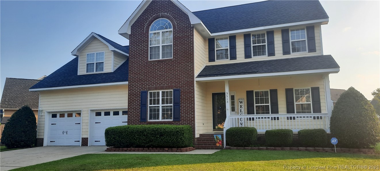 3513 Talus Road Fayetteville, NC 28306 - Photo 2 of 37 a front view of a house with garden