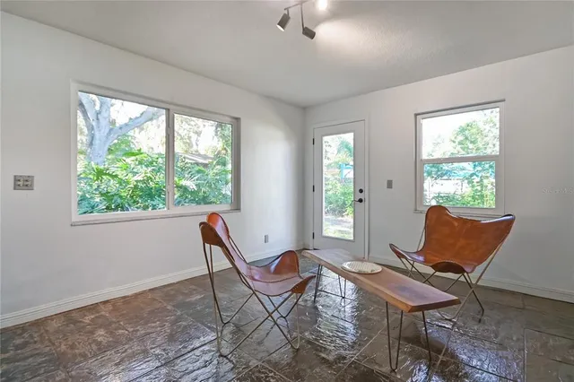 a workspace with furniture and a window