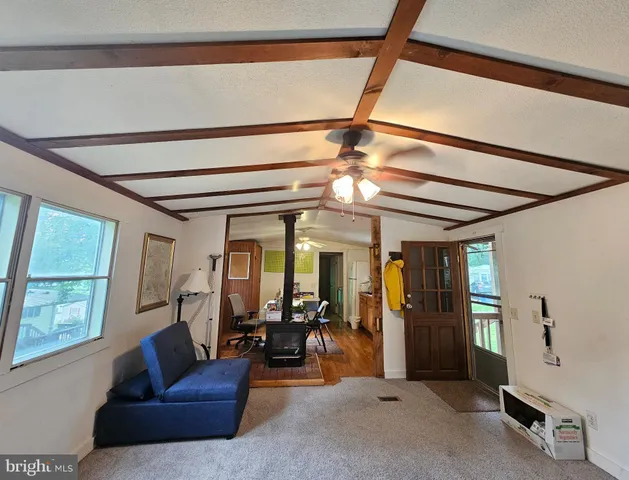 a view of livingroom with furniture and a flat screen tv