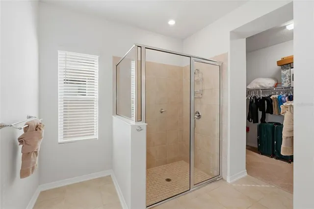 a bathroom with a shower and a sink