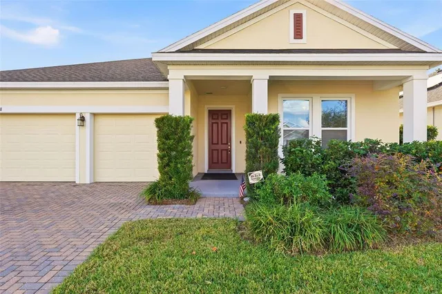 front view of a house with potted plants