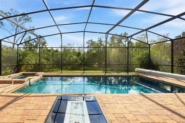 a swimming pool with chairs and view of swimming pool