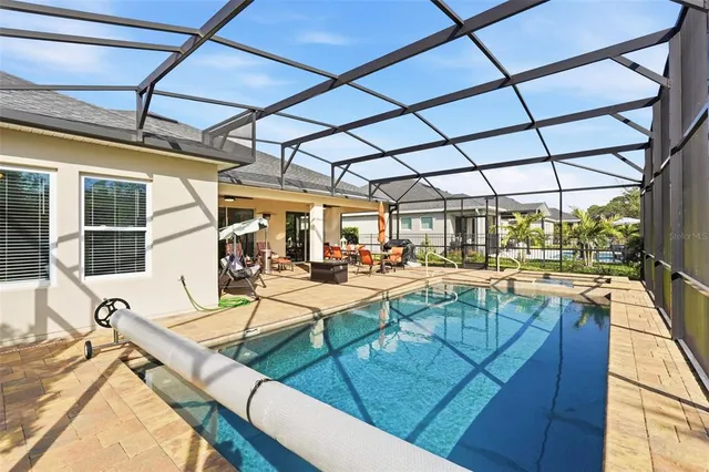 a view of house with a swimming pool