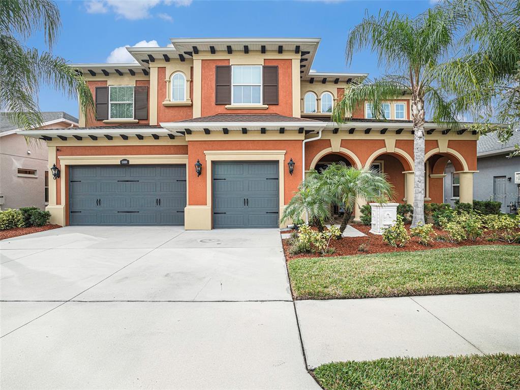 18010 Pine Hammock Boulevard Lutz, FL 33548 - Photo 1 of 1 front view of a house with a garden