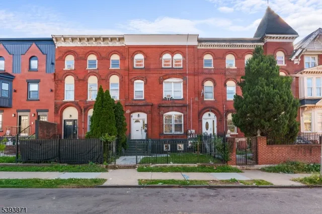 a front view of a building with garden