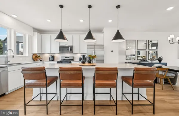 a dining room with furniture and wooden floor