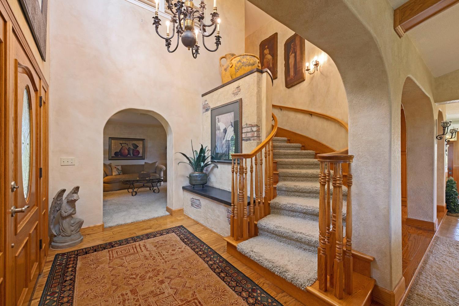 7583 East Realty Road Lodi, CA 95240 - Photo 6 of 41 Formal entry provides access to the family or sitting room, the bedrooms upstairs and the living/dining room areas.