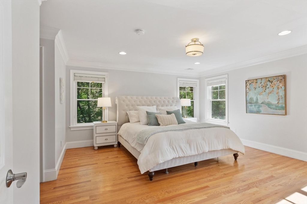 56 Old Marlboro Road Concord, MA 01742 - Photo 9 of 34 a bedroom with a bed and wooden floor