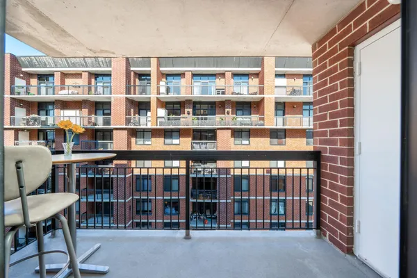 a large kitchen with stainless steel appliances granite countertop a stove and a wooden floors
