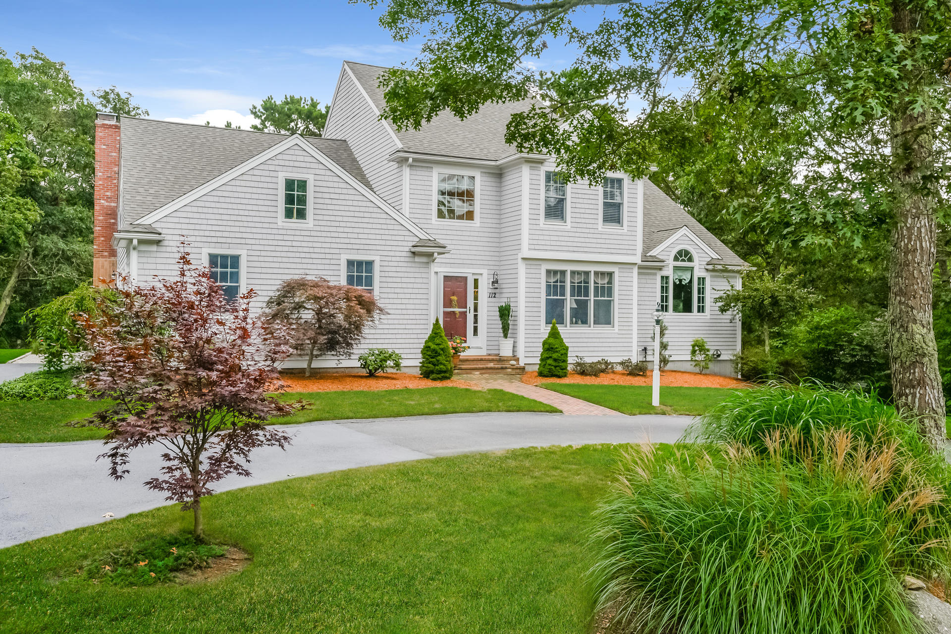 112 Cairn Ridge Road East Falmouth, MA 02536 - Photo 1 of 31 a view of a house with a yard and plants
