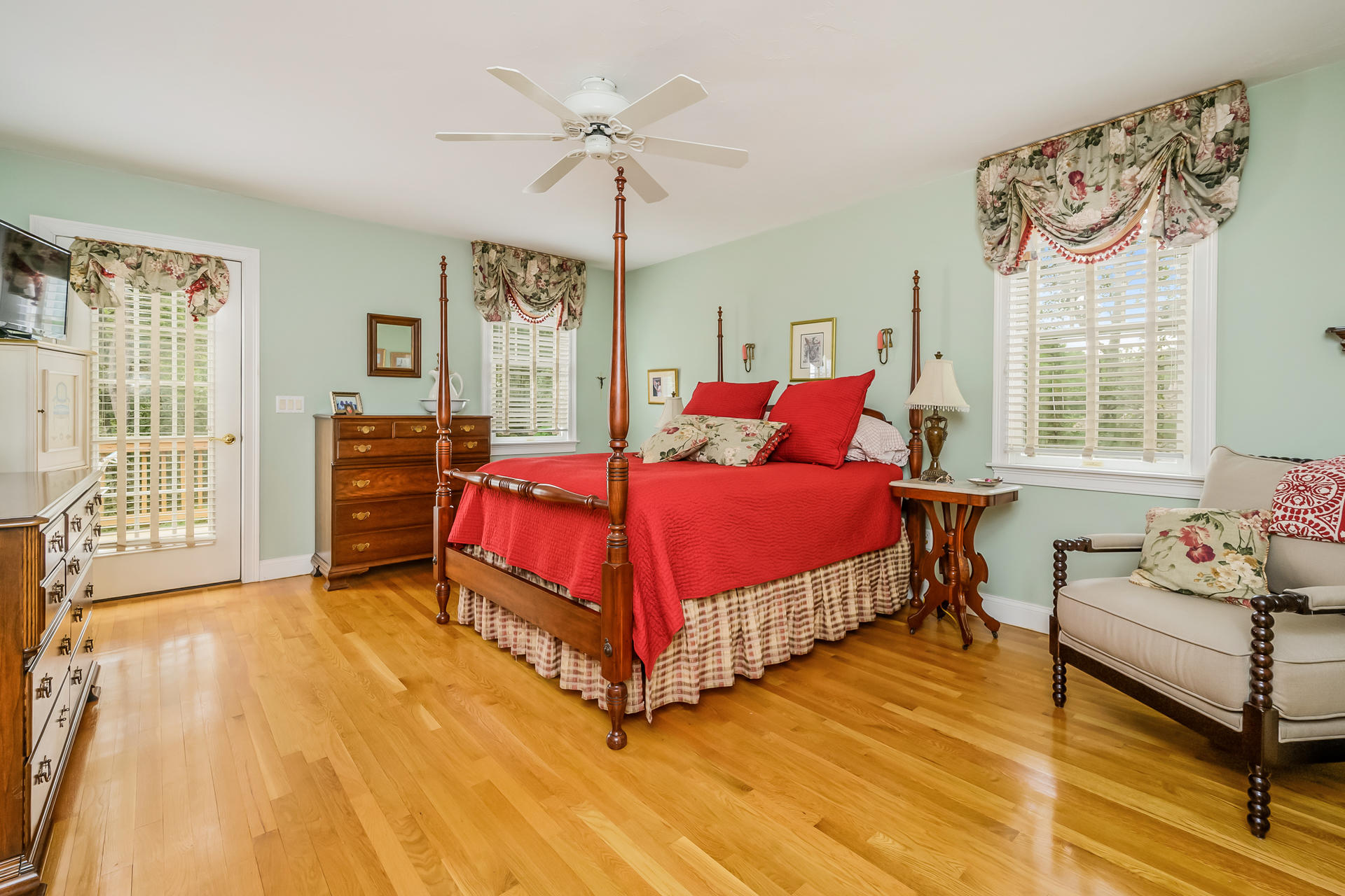 112 Cairn Ridge Road East Falmouth, MA 02536 - Photo 12 of 31 a bedroom with a bed and wooden floor