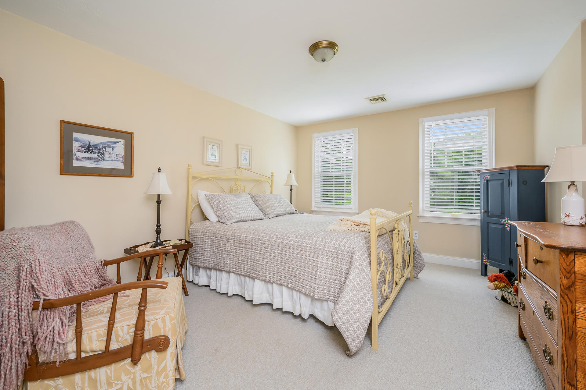 112 Cairn Ridge Road East Falmouth, MA 02536 - Photo 18 of 31 a bedroom with a bed and a flat tv screen on the dresser