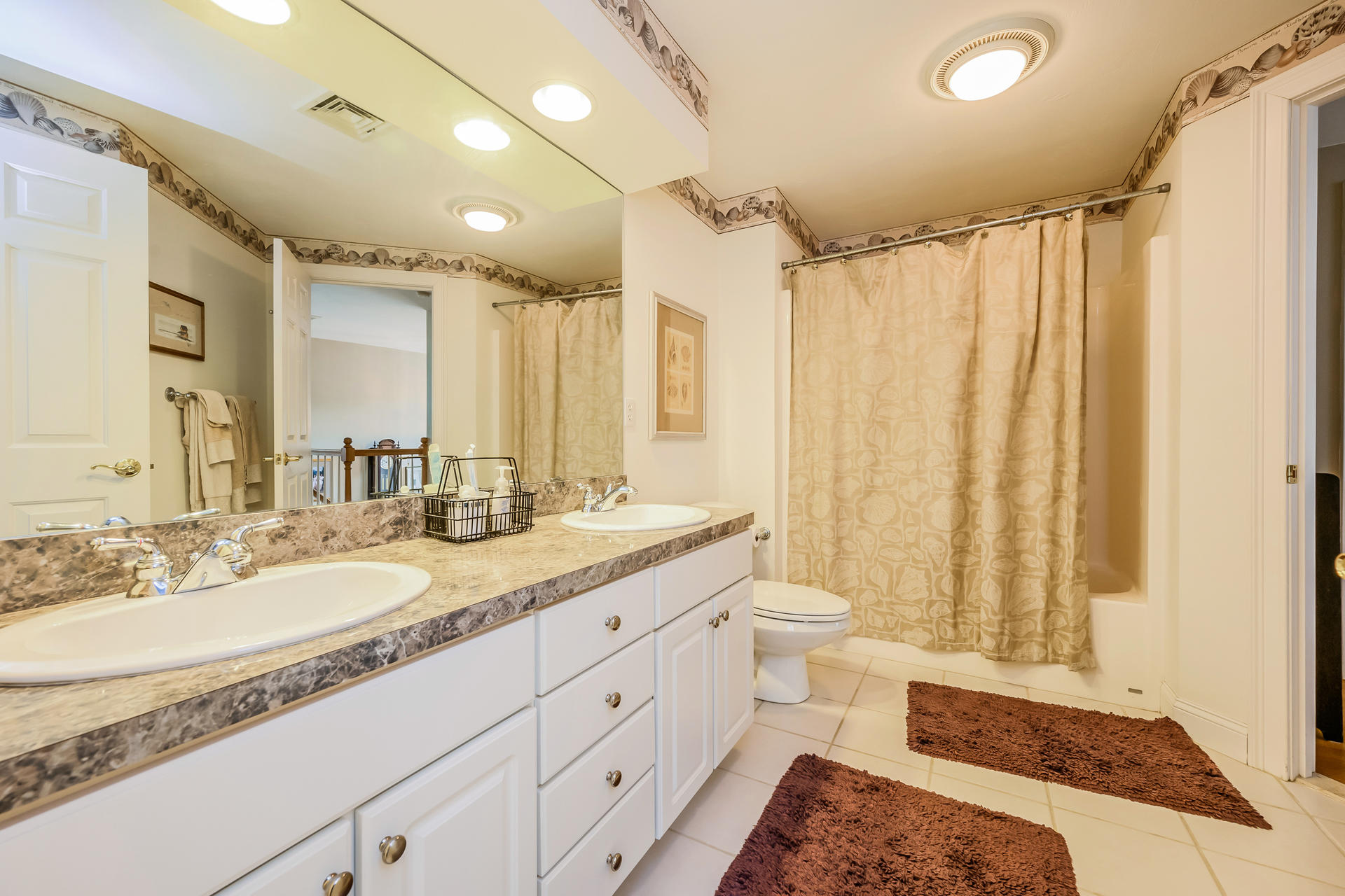 112 Cairn Ridge Road East Falmouth, MA 02536 - Photo 20 of 31 a spacious bathroom with a double vanity sink toilet and shower