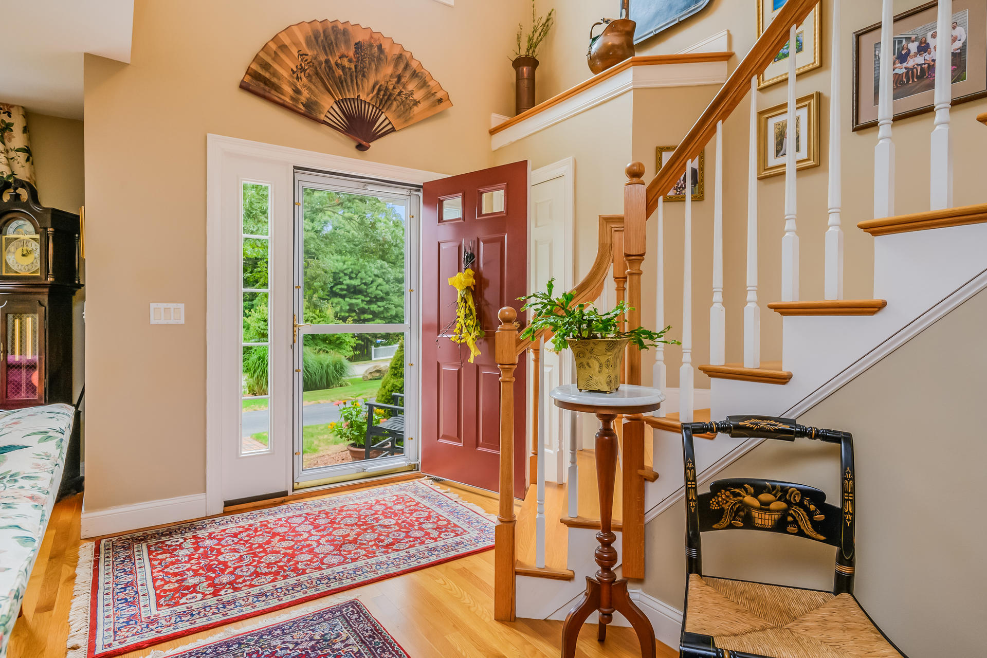 112 Cairn Ridge Road East Falmouth, MA 02536 - Photo 2 of 31 a view of an entryway with wooden floor and a rug
