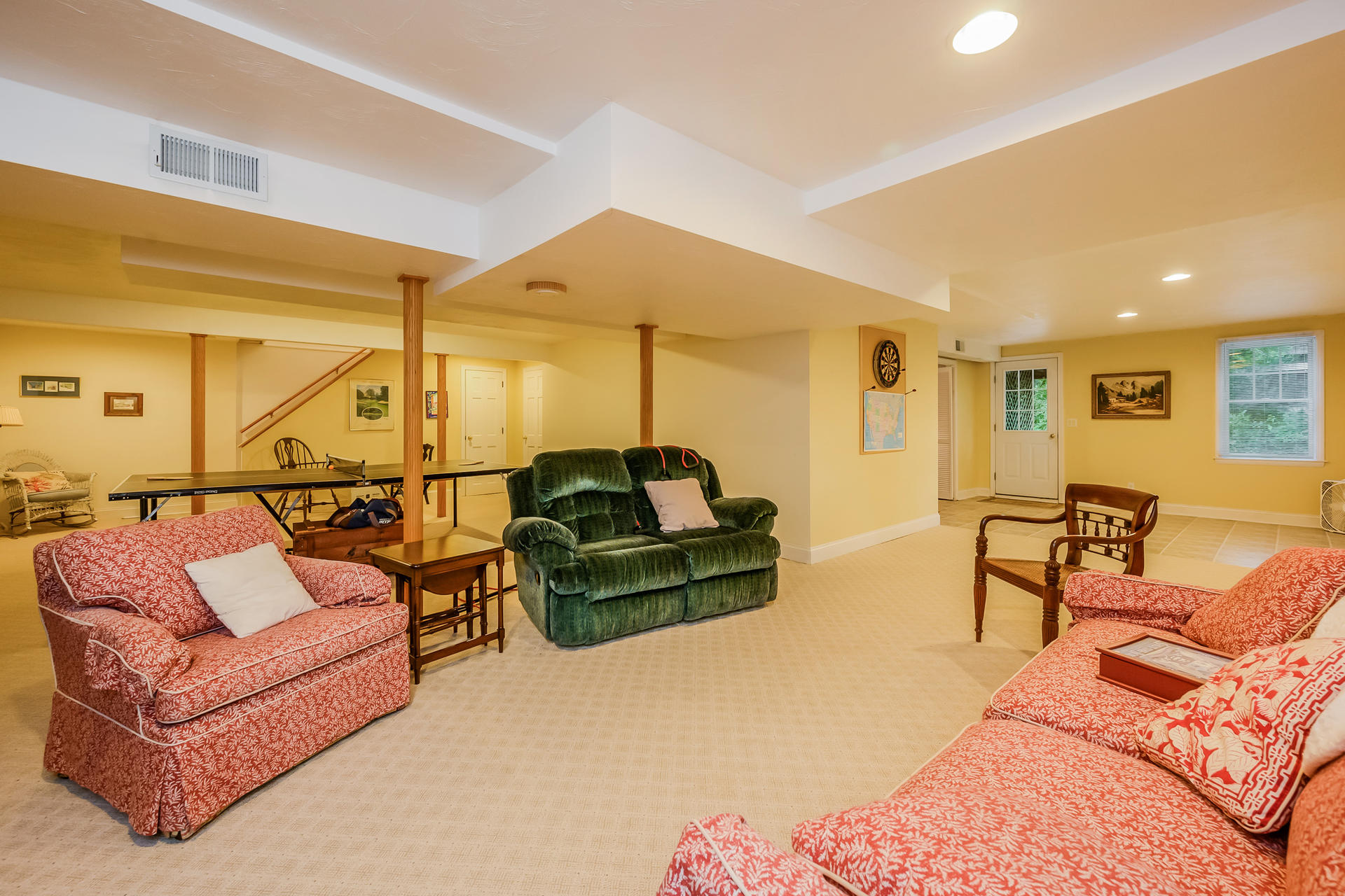 112 Cairn Ridge Road East Falmouth, MA 02536 - Photo 21 of 31 a living room with furniture a rug and a chandelier