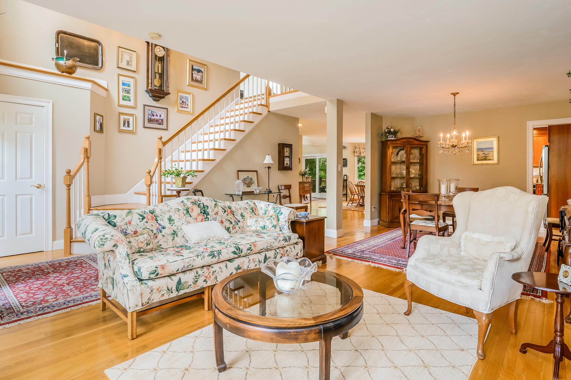 112 Cairn Ridge Road East Falmouth, MA 02536 - Photo 4 of 31 a living room with furniture and a chandelier