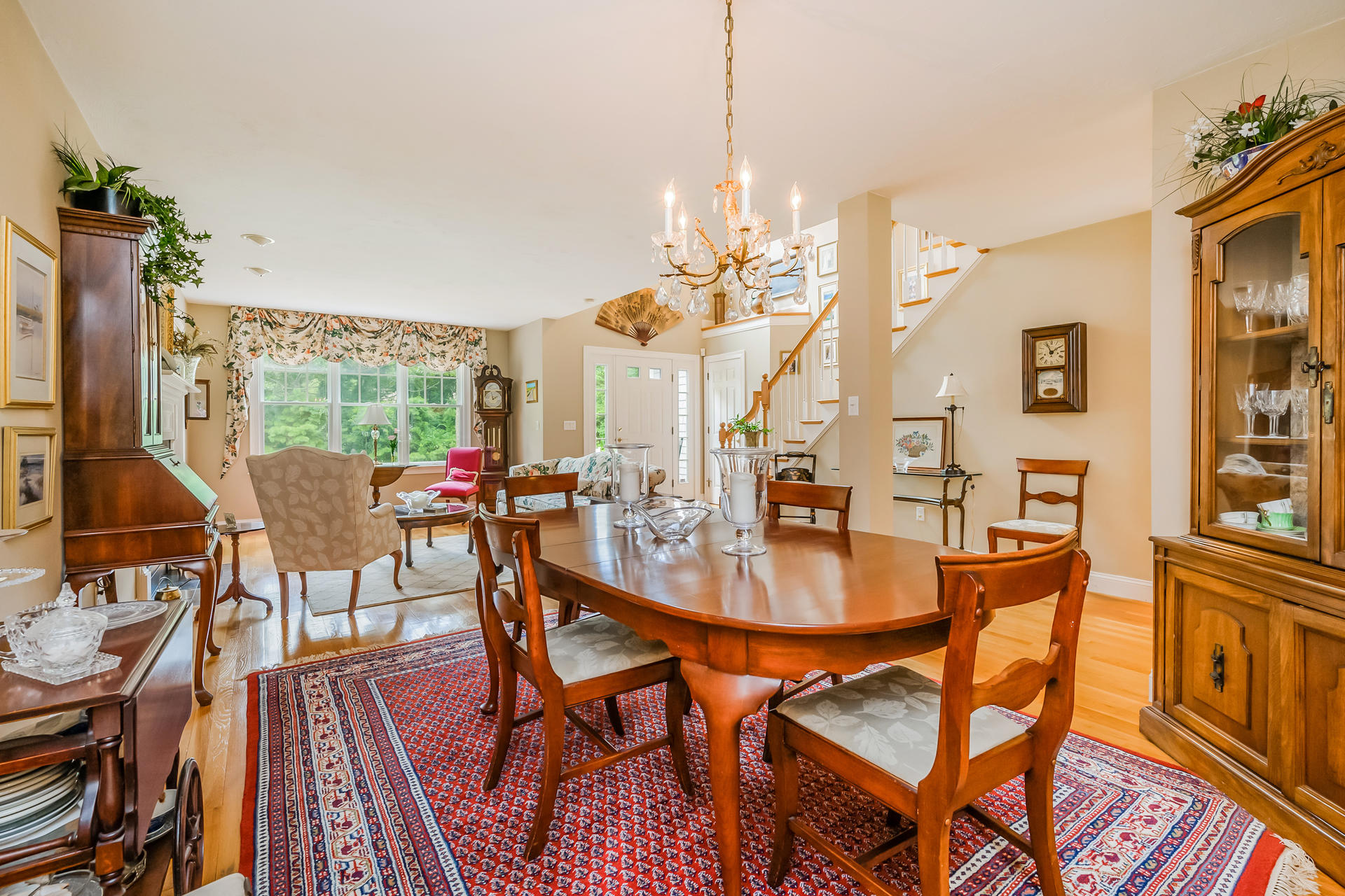 112 Cairn Ridge Road East Falmouth, MA 02536 - Photo 5 of 31 a view of a dining room with furniture a chandelier and wooden floor