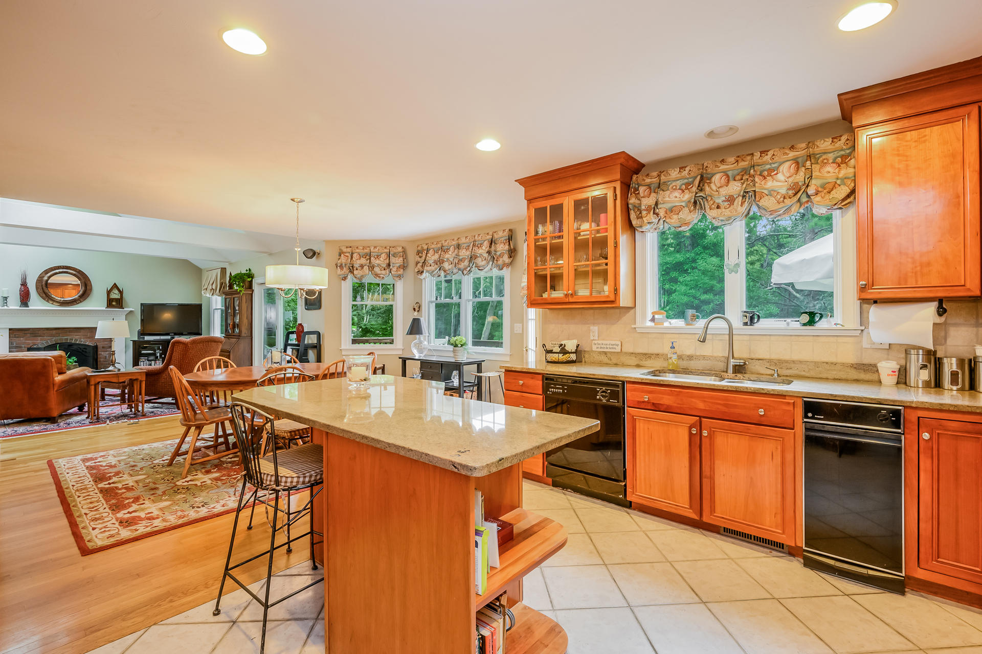 112 Cairn Ridge Road East Falmouth, MA 02536 - Photo 9 of 31 a open kitchen with stainless steel appliances granite countertop a sink and cabinets