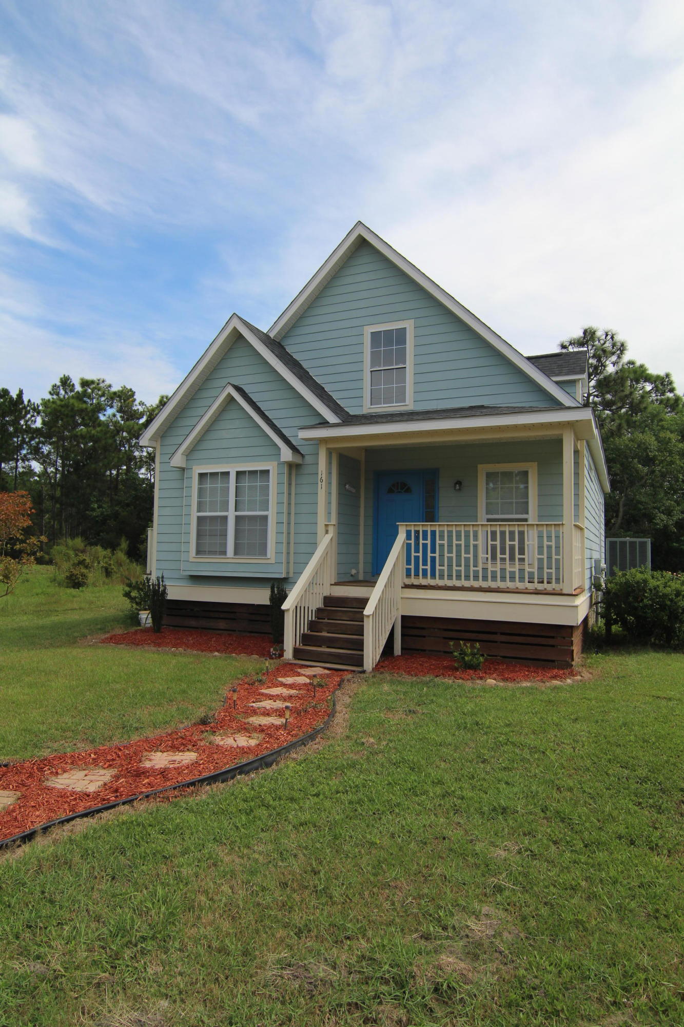 161 6th Street Santa Rosa Beach, FL 32459 - Photo 1 of 13 a view of a house with a yard and deck