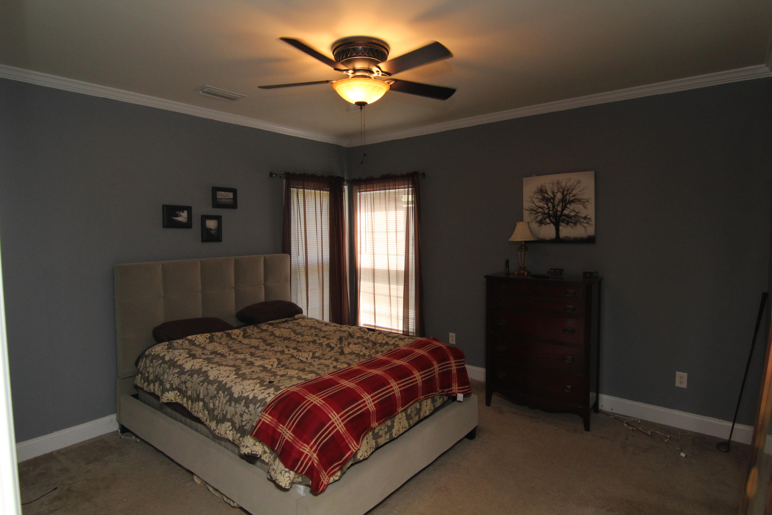 161 6th Street Santa Rosa Beach, FL 32459 - Photo 2 of 13 a bedroom with a bed and a chandelier