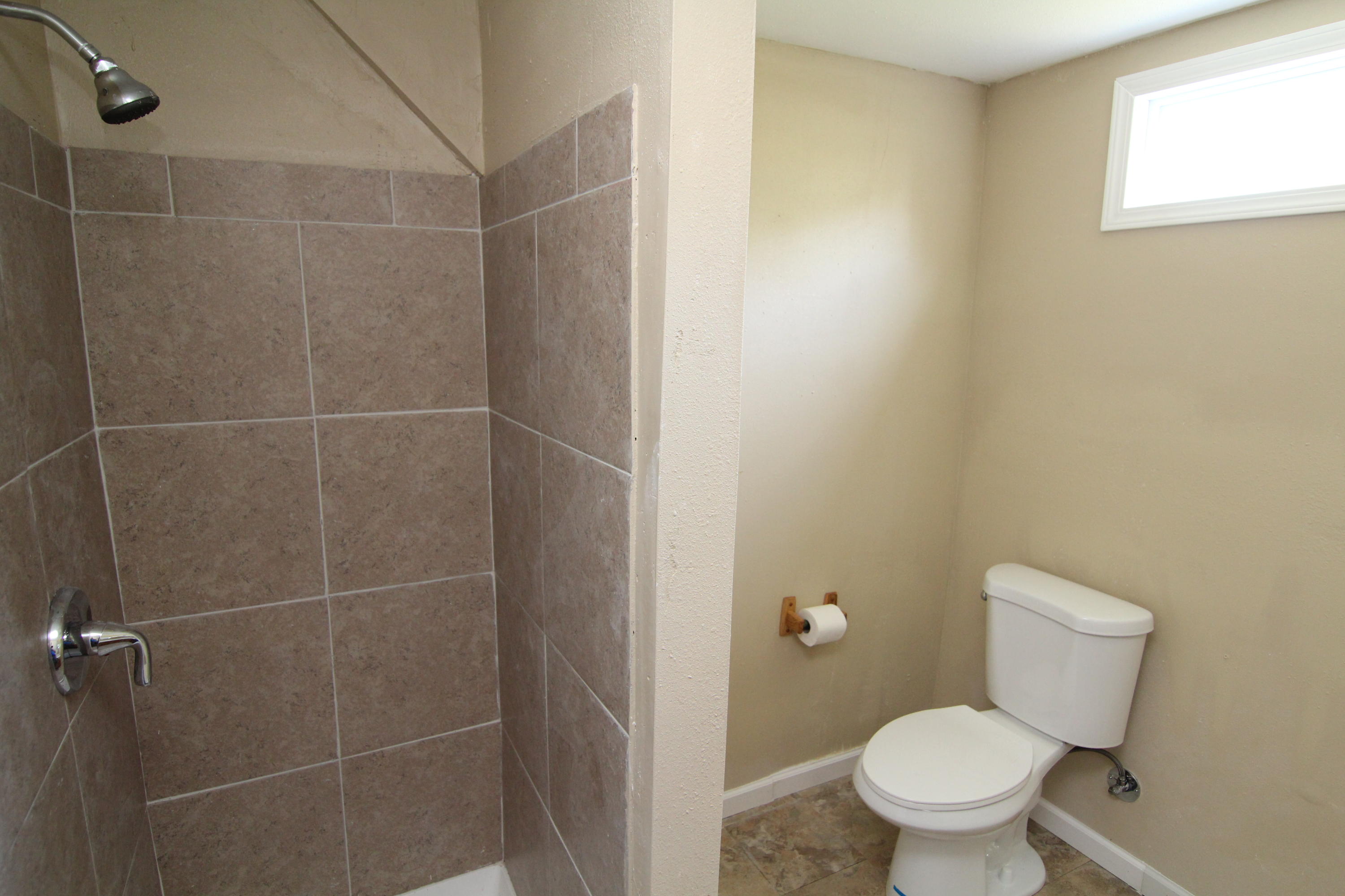 161 6th Street Santa Rosa Beach, FL 32459 - Photo 11 of 13 a bathroom with a toilet and a shower