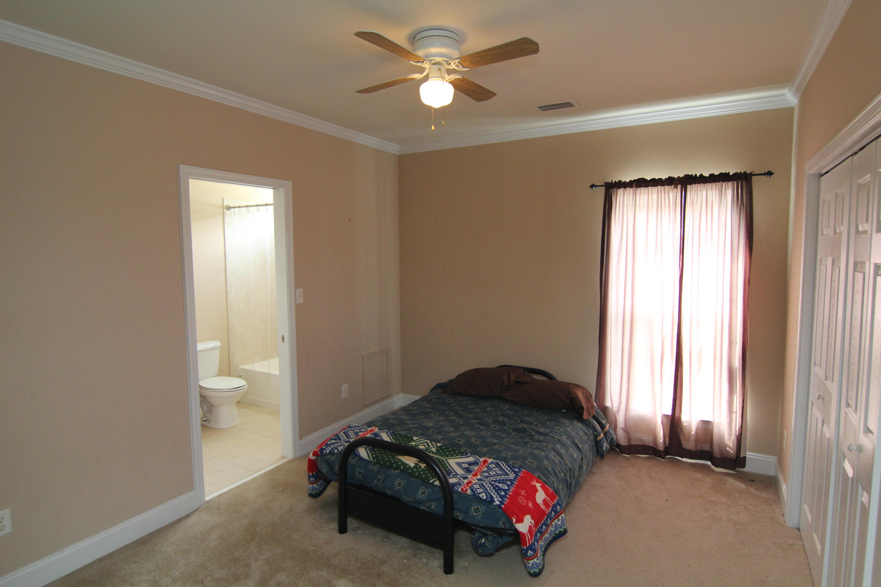 161 6th Street Santa Rosa Beach, FL 32459 - Photo 5 of 13 a bedroom with a bed and a window