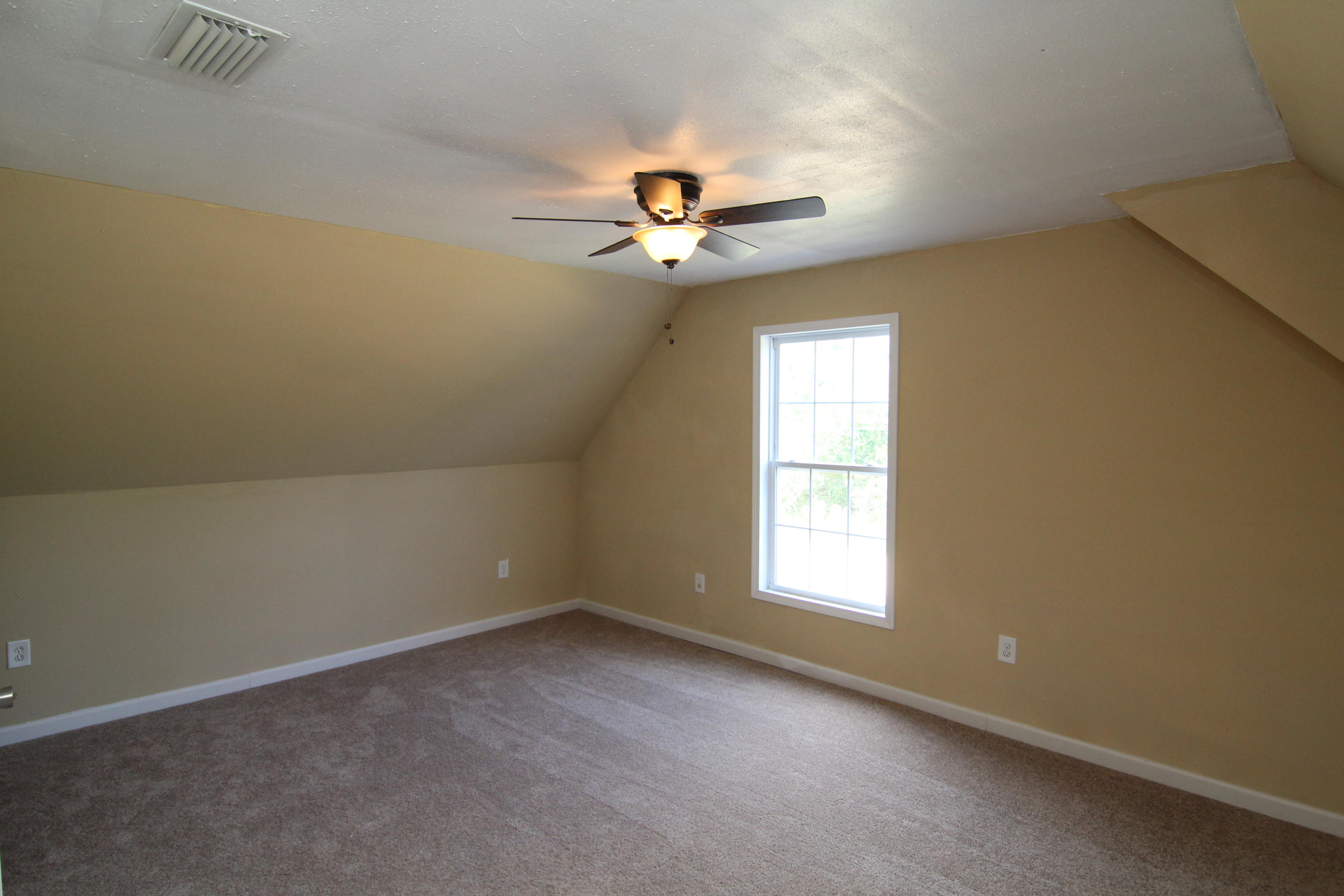 161 6th Street Santa Rosa Beach, FL 32459 - Photo 9 of 13 an empty room with windows and fan