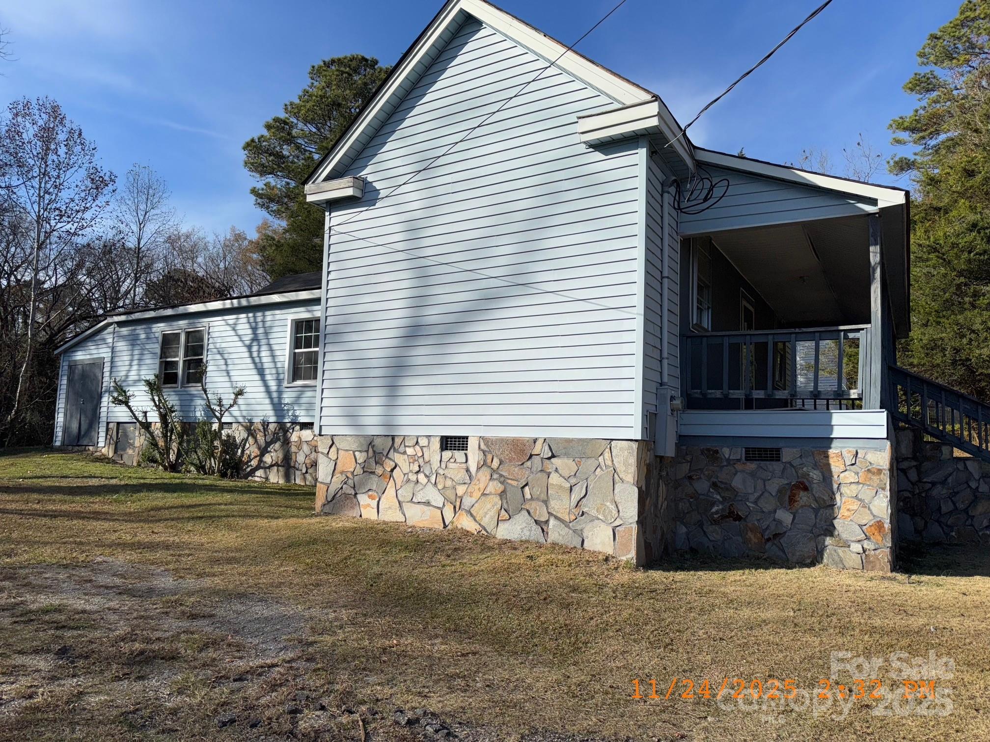 1217 Roberdell Road Rockingham, NC 28379 - Photo 2 of 12 a view of a house with a yard