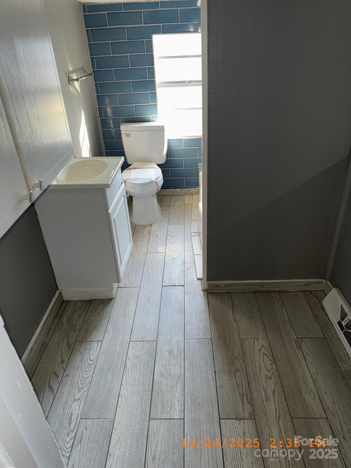 1217 Roberdell Road Rockingham, NC 28379 - Photo 8 of 12 a bathroom with a sink and a toilet