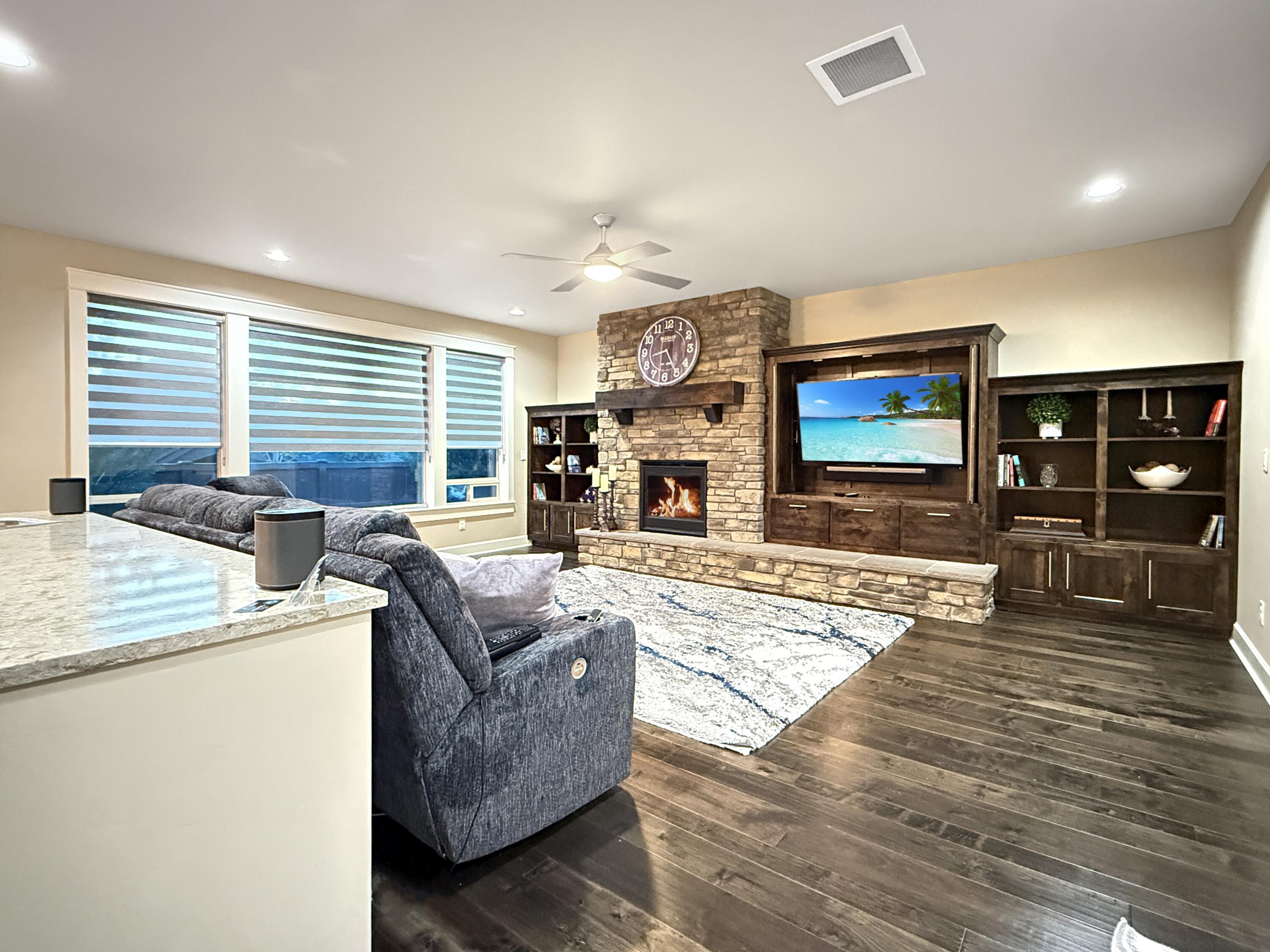 61072 Manhae Loop Bend, OR 97702 - Photo 14 of 63 a living room with furniture and a flat screen tv