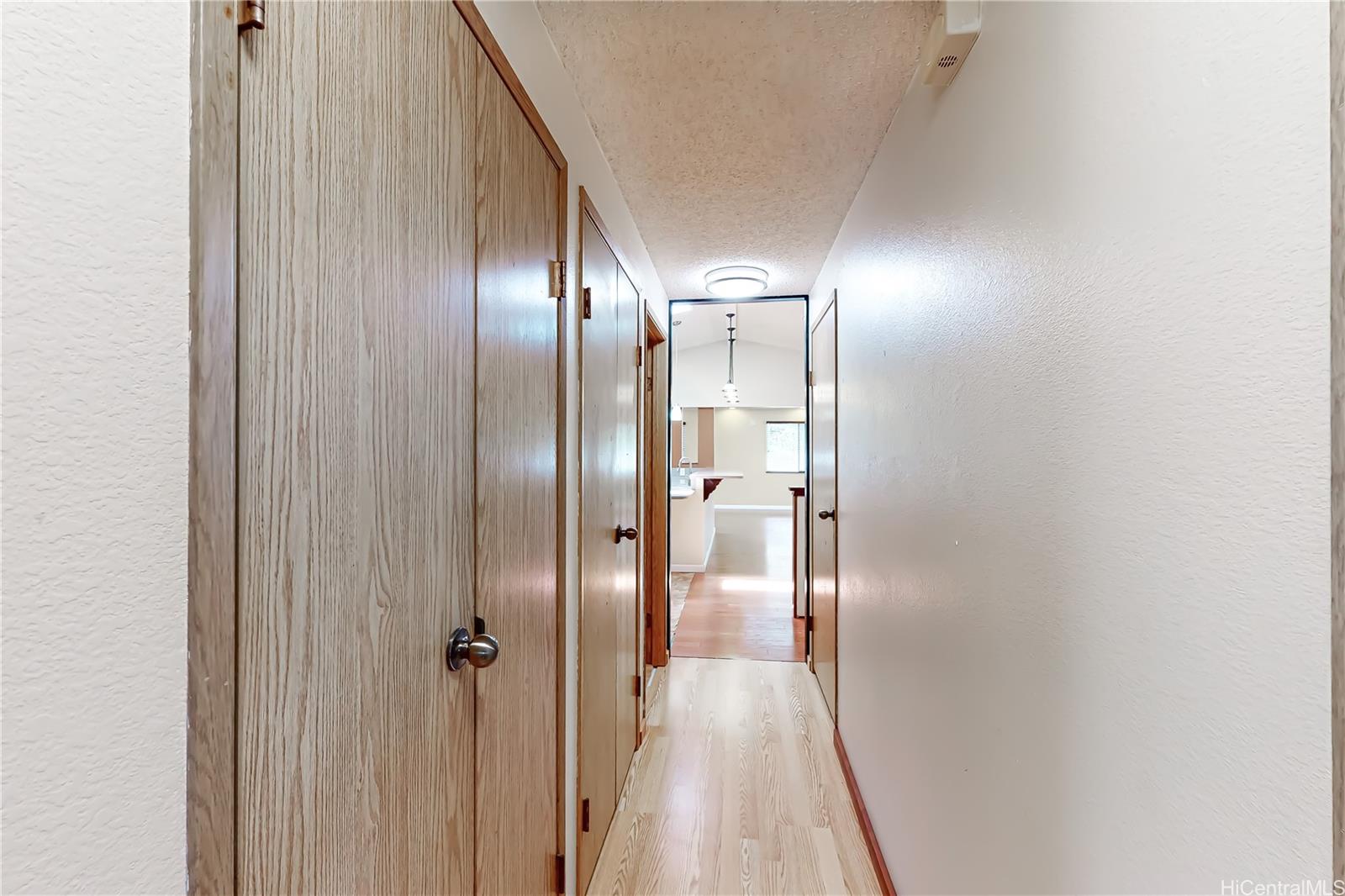 45-655 Apapane Street, Unit UPSTAIRS Kaneohe, HI 96744 - Photo 13 of 19 Hallway leading to Bedrooms & Bathrooms