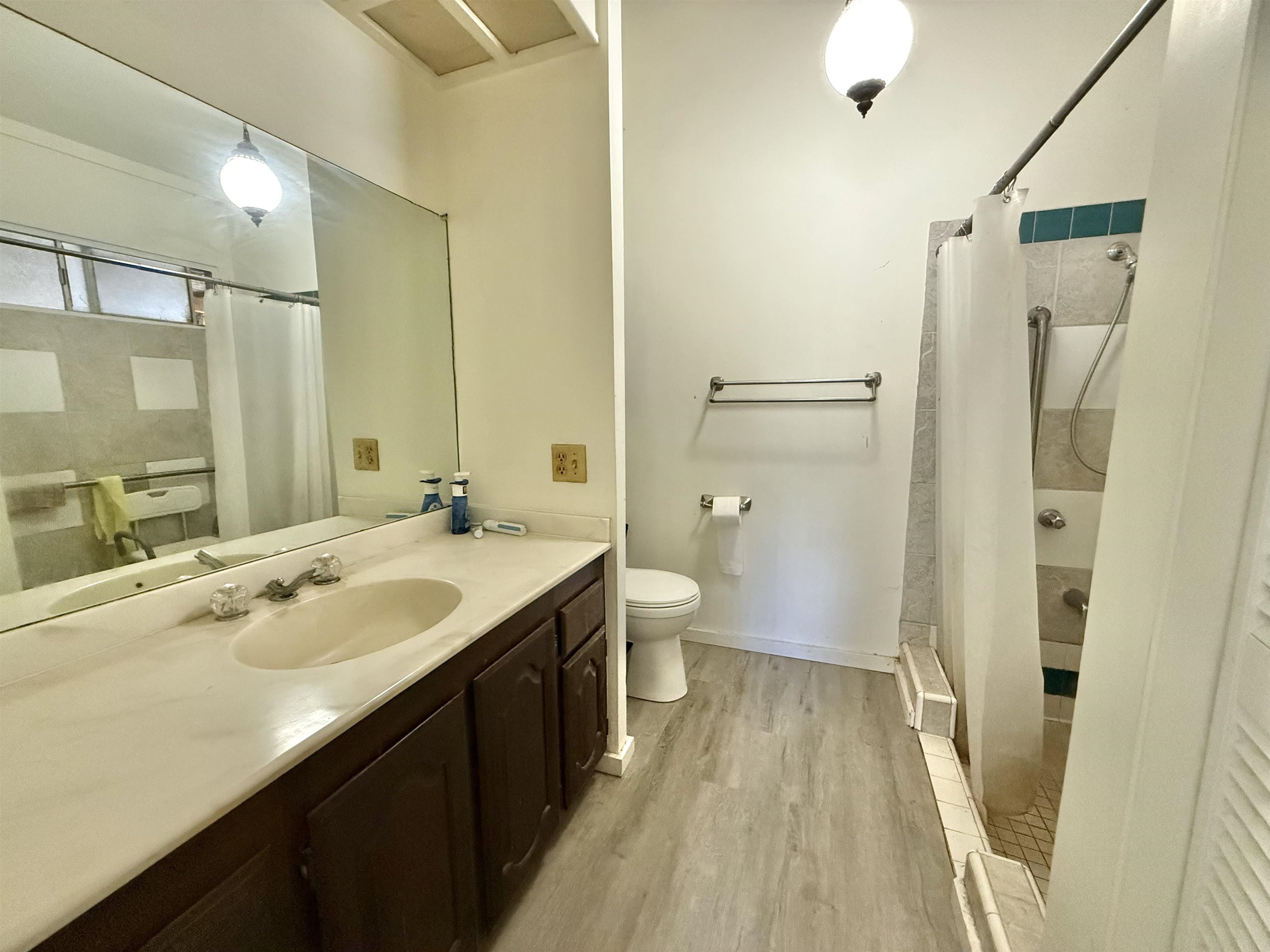 1630 Kauhikoa Road Haiku, HI 96708 - Photo 16 of 48 a spacious bathroom with a shower sink and a toilet