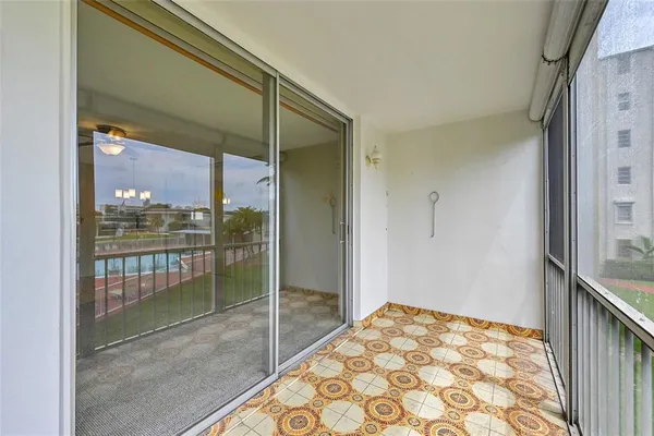 a bedroom with a bed and glass door